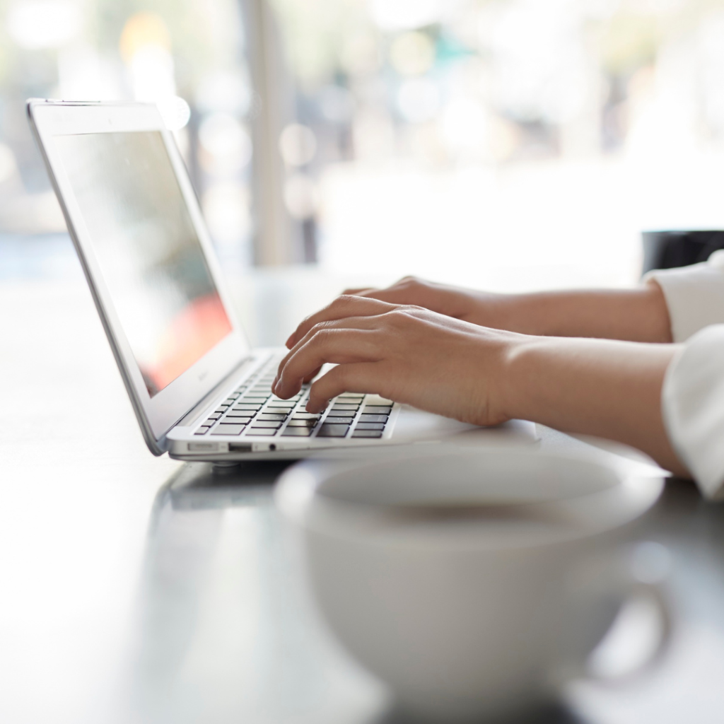 Working on laptop designing a website